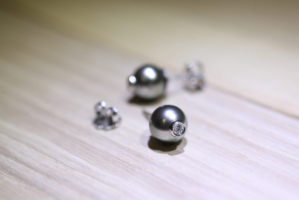 Moonlight serenade collection, a Tahitian pearls and diamond ring in white gold situated on wooden table