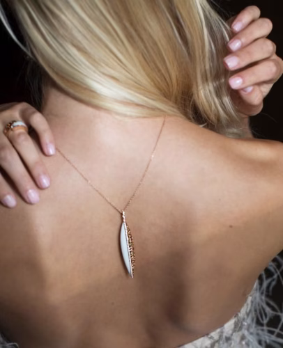 Model dancing in evening gown with MIYOCO Necklace with Nature inspired design