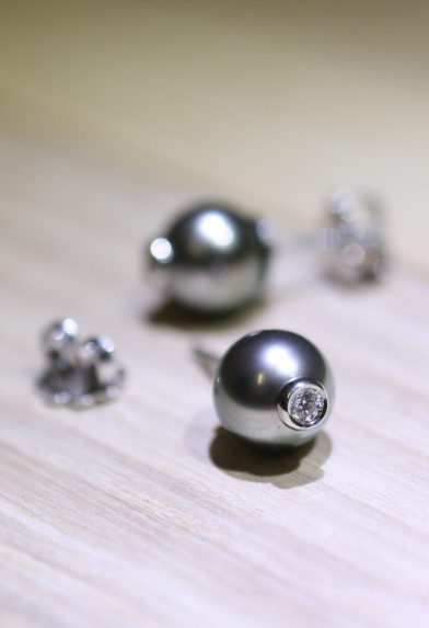 Moonlight serenade collection, a Tahitian pearls and diamond ring in white gold situated on wooden table