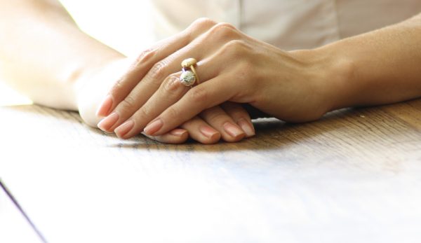 Lilac motif rings with diamond in white gold and yellow gold wearing at home